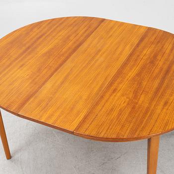 A teak-veneered dining table, second half of the 20th century.