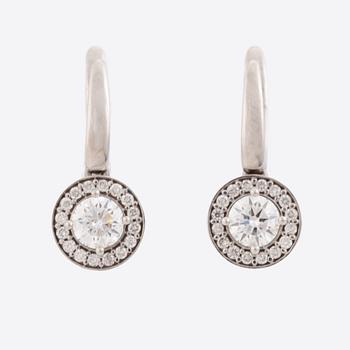 Brilliant-cut diamond earrings.