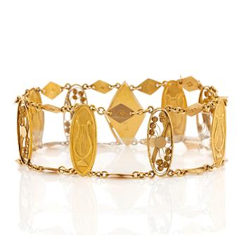 550B. A bracelet in 20K gold.