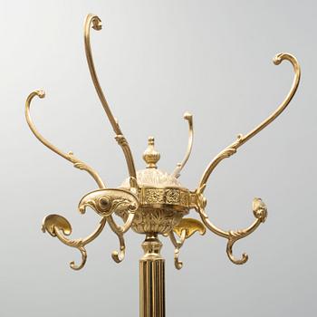 a brass coat hanger from the late 20th century.