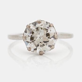 A platinum ring set with a round brilliant-cut diamond weight ca 4.90 cts quality ca W si.