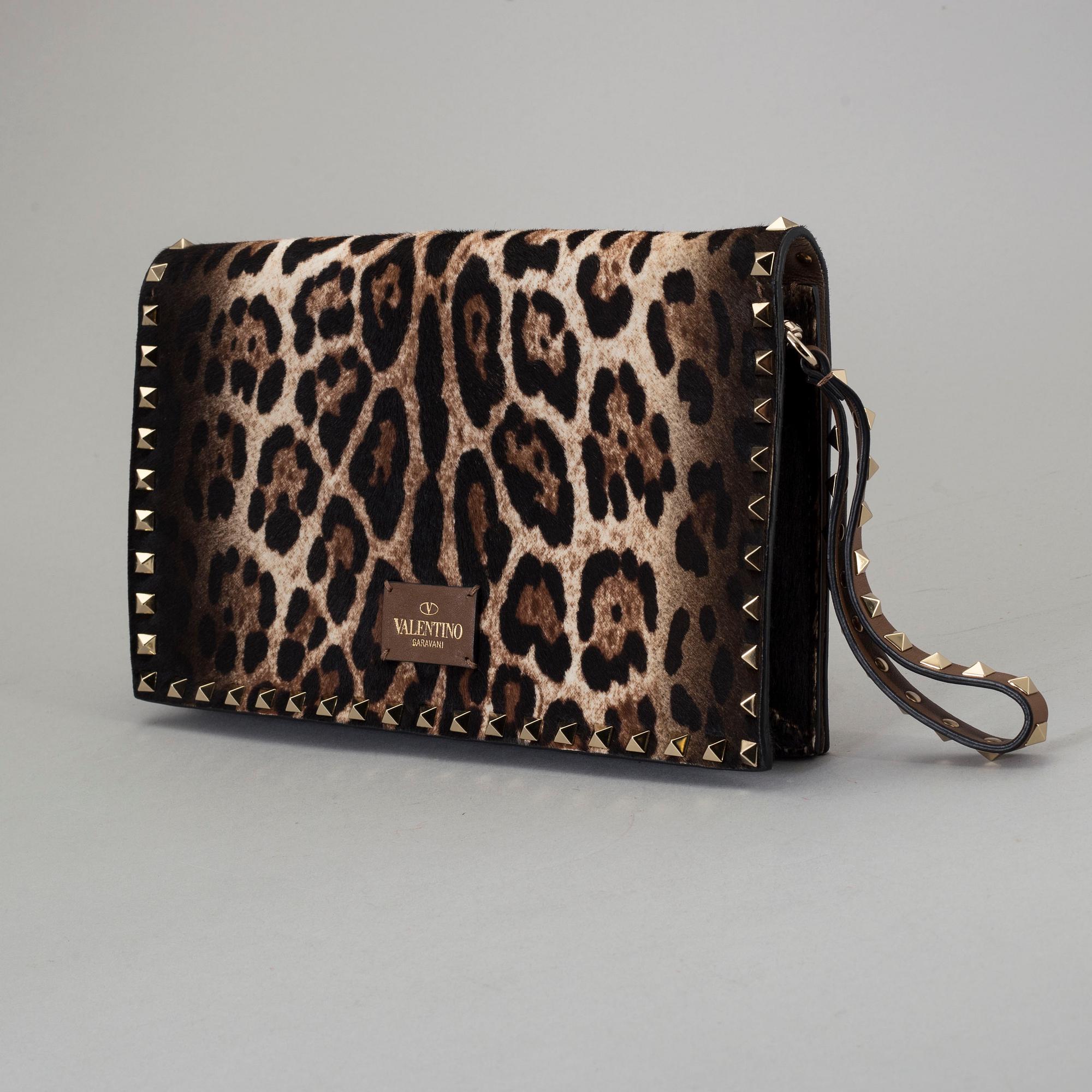A ponyhair clutch with studs by Valentino.