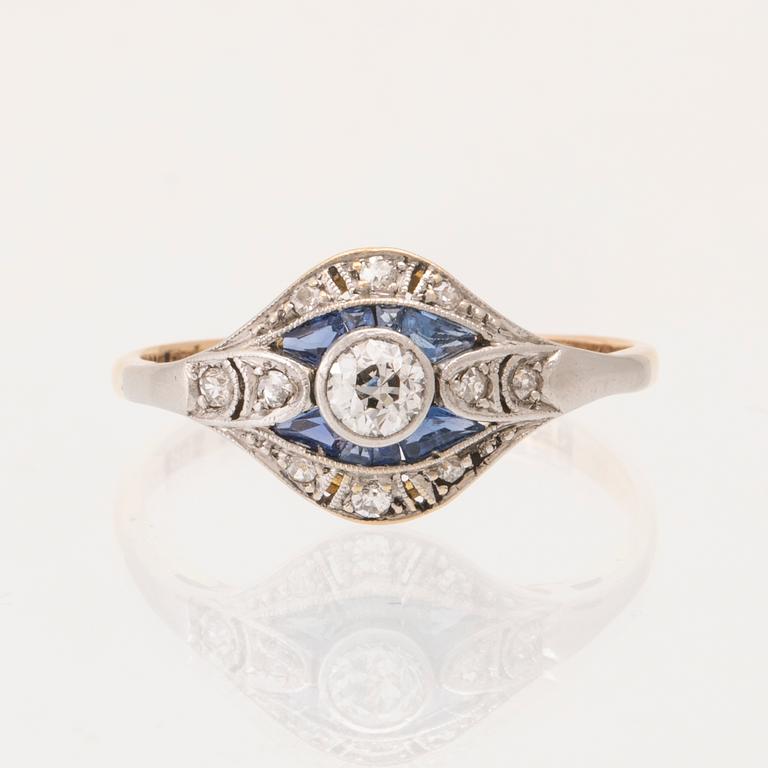An 18K white and red gold ring set with old-cut diamonds and step-cut blue gemstones, Petterssons Stockholm 1937.