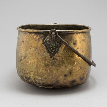 An 18th century brass cauldron.