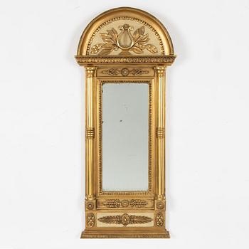An Empire mirror, first half of the 19th century.