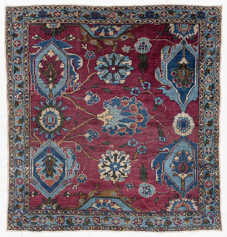 An antique rug, north-west Persian, so-called Vaghire, approx. 136 x 134 cm.