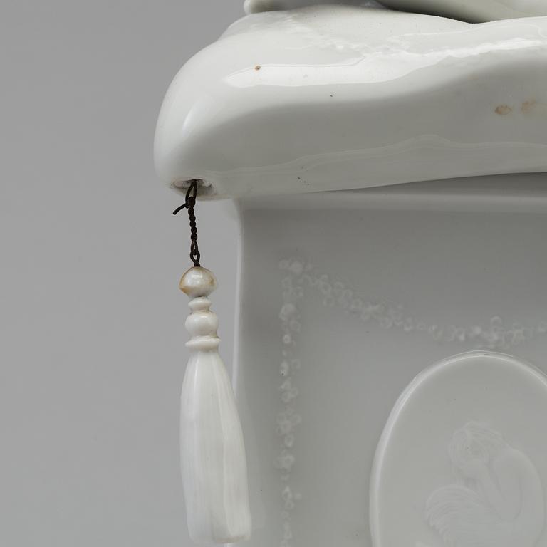A white glazed Royal Copenhagen porcelain nodding head figure, Denmark, early 20th Century. Not first quality.