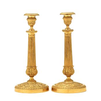 A pair of Empire early 19th century candlesticks.