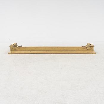 A brass fire guard, around 1900.
