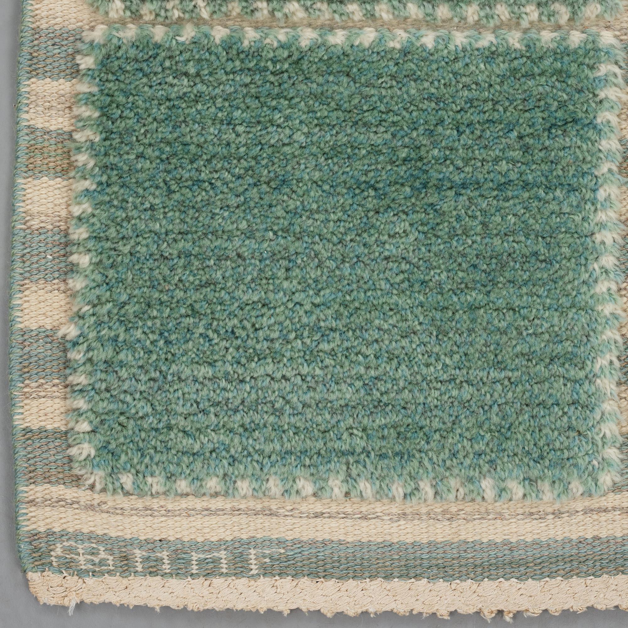 Barbro Nilsson, A carpet, "Gyllenrutan grön", knotted pile in relief ca 240,5-241,5 x 135,5-138 cm, signed AB MMF BN.