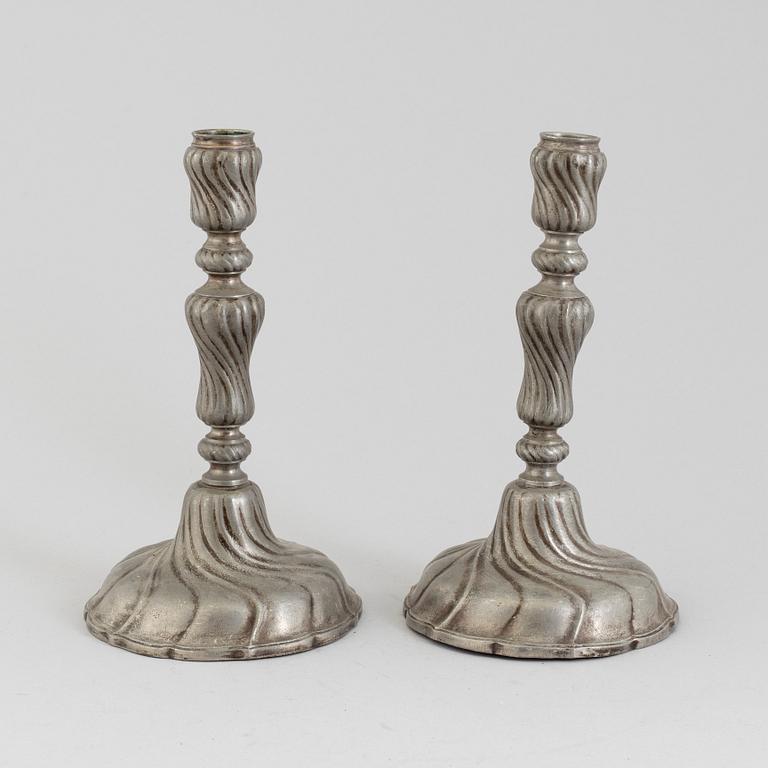 A PAIR OF ROCOCO PEWTER CANDLESTICKS, 18th century.