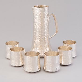 TAPIO WIRKKALA, a sterling silver pitcher and six beakers for Kultakeskus Hämeenlinna 1973.