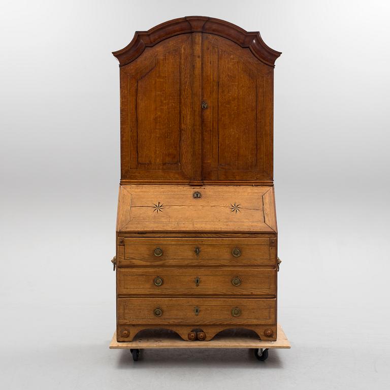 A first half of the 18th century oak writing cabinet.