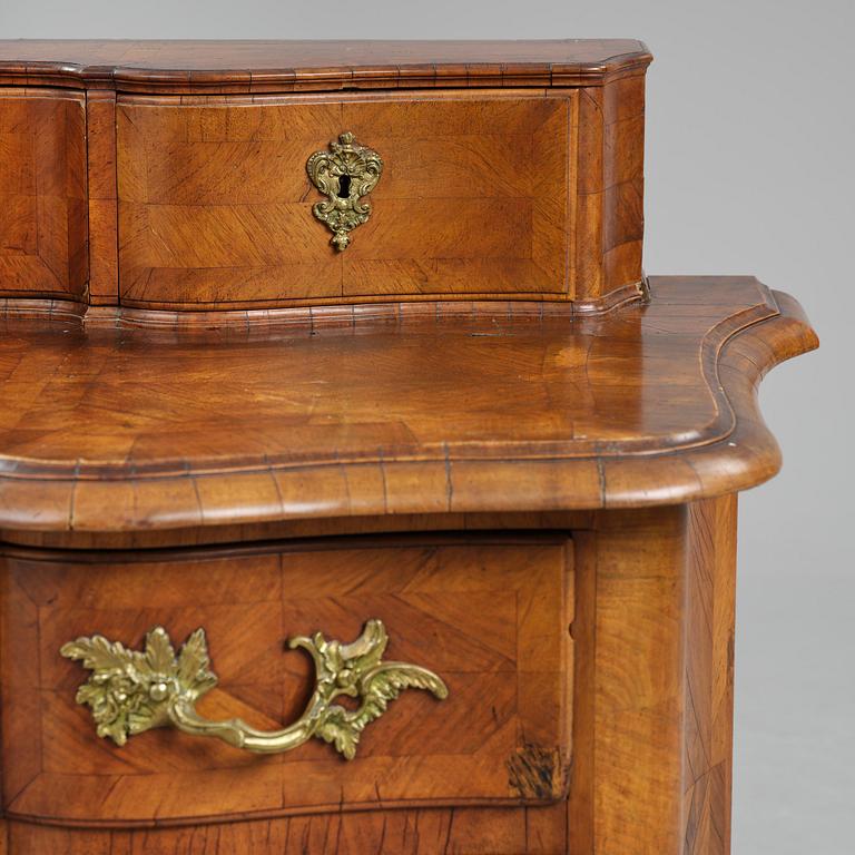 A late baroque walnut parquetry commode by C. Linning (master in Stockholm 1744-79).