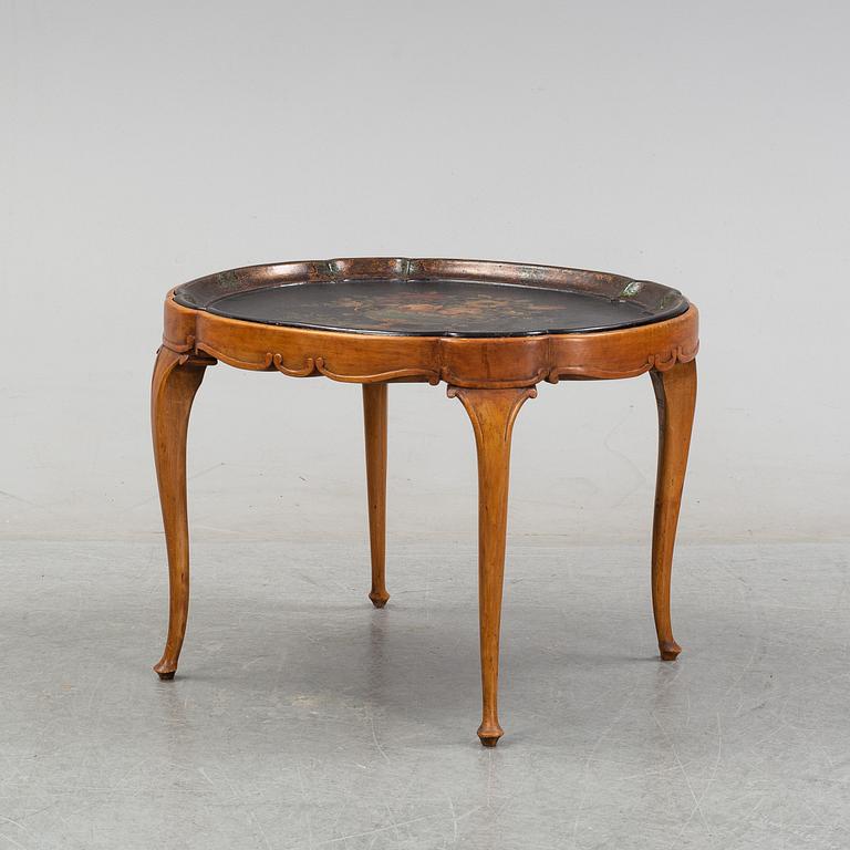 A rococo style side table with a loose tray.