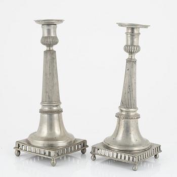 A matched pair of pewter candle sticks, 19th Century.