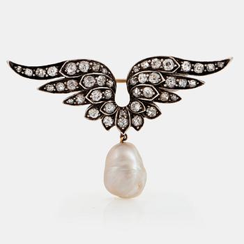 1101. A silver and 14K gold brooch set with old-cut diamonds and a drop shaped pearl.