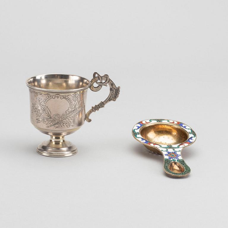 A russian cup and strainer in silver and enamel from 1896 and after 1958.
