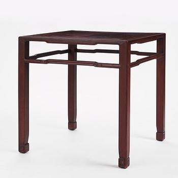 A Chinese hardwood corner-leg table, Qing dynasty.