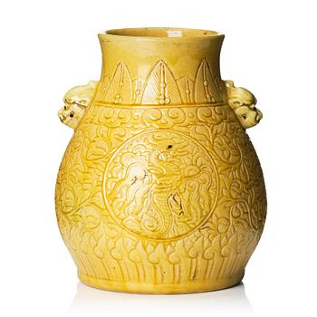 1293. A yellow glazed phoenix vase,  Qing dynasty, with a Kangxi mark.