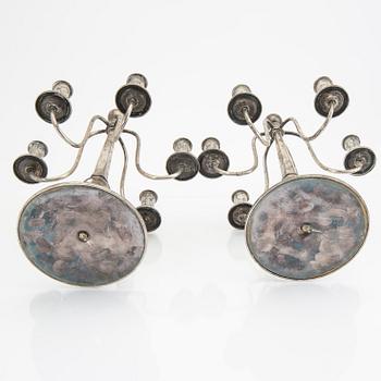 A Swedish 20th century pair of silver candelabras mark of CG Hallberg Stockholm 1928 possibly Elis Bergh.
