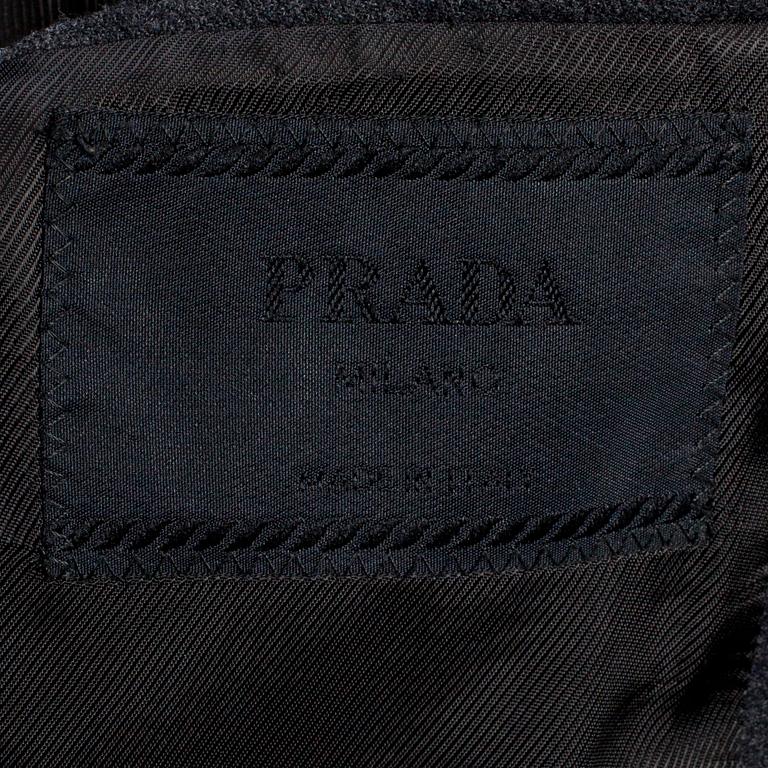 PRADA, a men's suit consisting of jacket and pants.