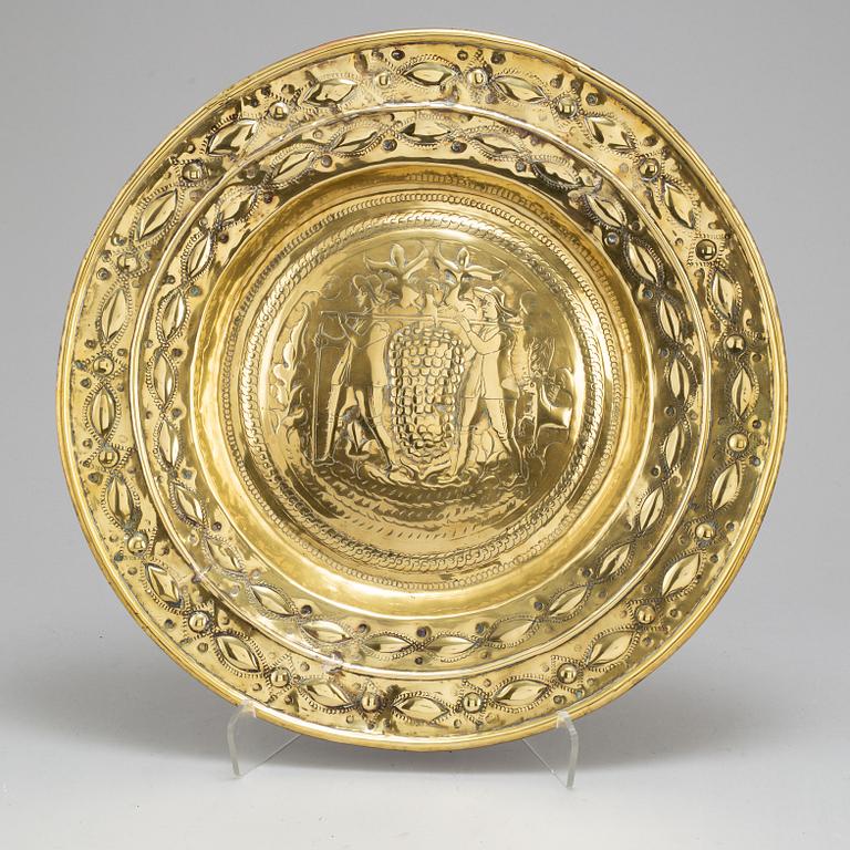 A 17th century brass plate.