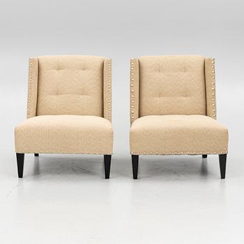 A pair of 'Triton custom chair' lounge chairs, Andrew & Martin, England, 21st century.
