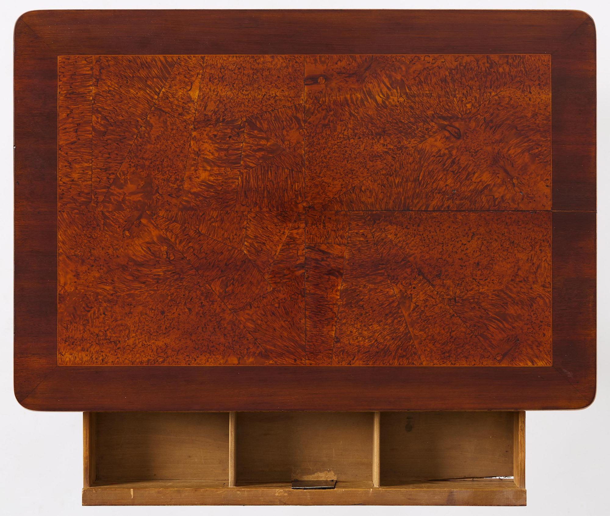 A Gustavian burr-parquetry and bilt brass-mounted table by A. Lundelius (master in Stockholm 1778-1823).