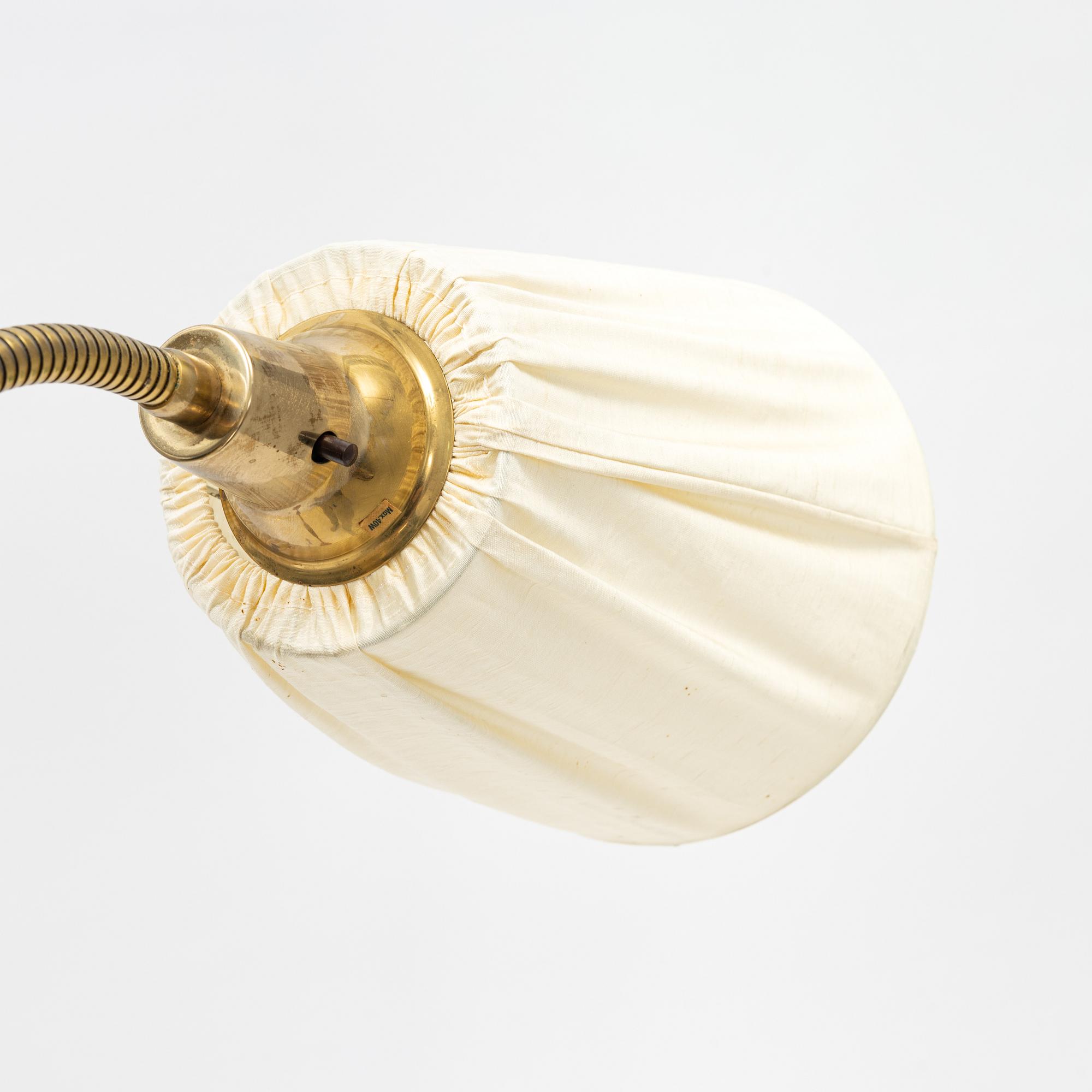 A brass and teak floor light, 1950's.