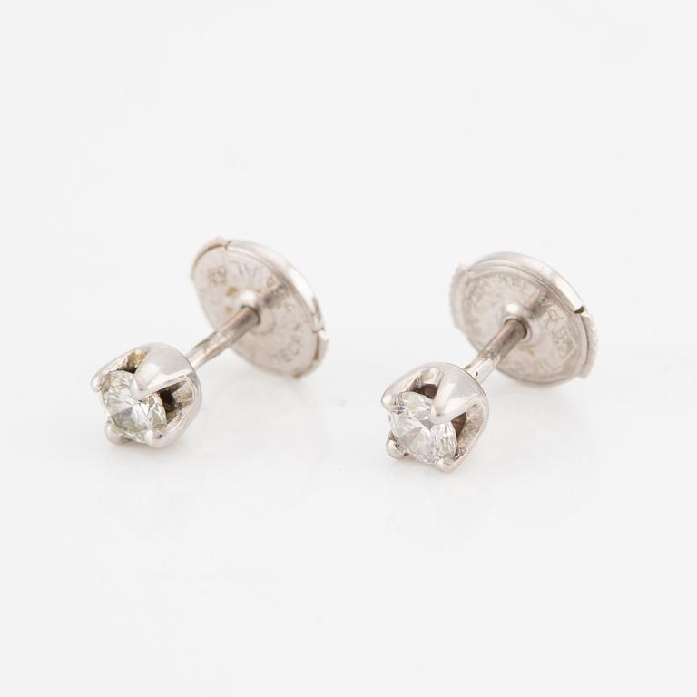 A pair of earrings in 18K white gold with round brilliant-cut diamonds.