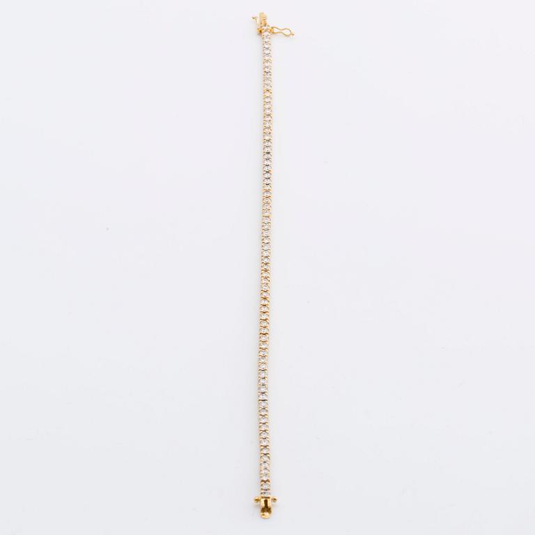 TENNISARMBAND 18K guld med 70 briljanter ca 3 ct totalt.