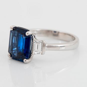 A platinum ring set with a step-cut sapphire weight 4.58 cts.