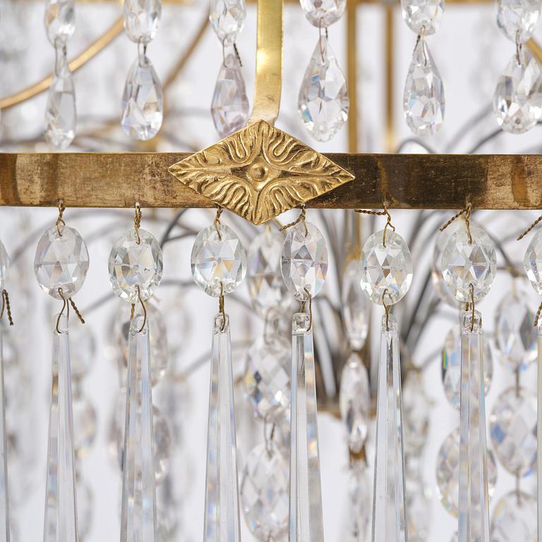 A late Gustavian gilt brass and cut glass eight-branch chandelier, Stockholm, late 18th century.