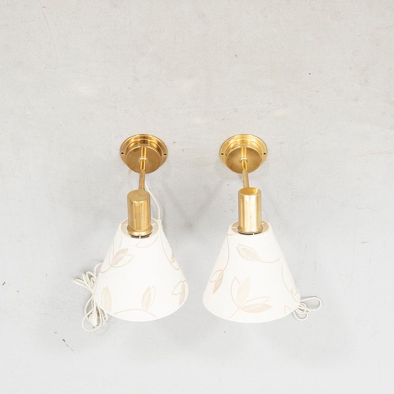 Tomas Jelinek,  a pair of brass Stockholm wall lamps for IKEA 1990s.