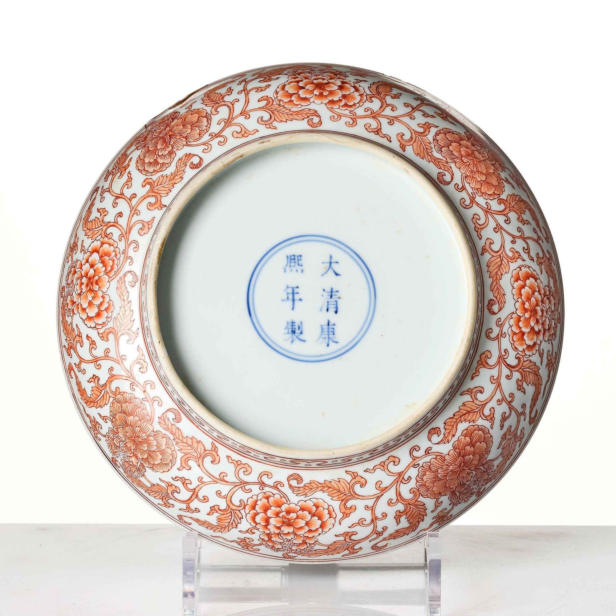 An iron red decorated 'lotus' dish, Qing dynasty, with a Kangxi six character mark and of the period (1662-1722).