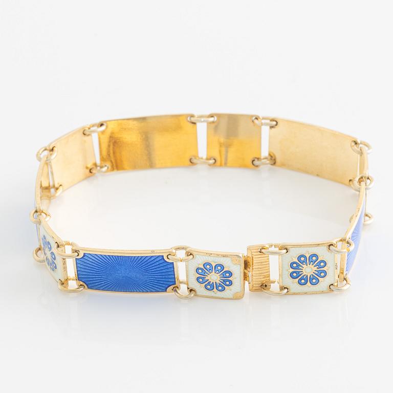 David Andersen, bracelet and two brooches, gilded silver and enamel, Norway.