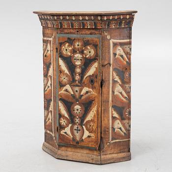 A Swedish traditional painted corner cabinet, Dalarna, 18th-/19th century.