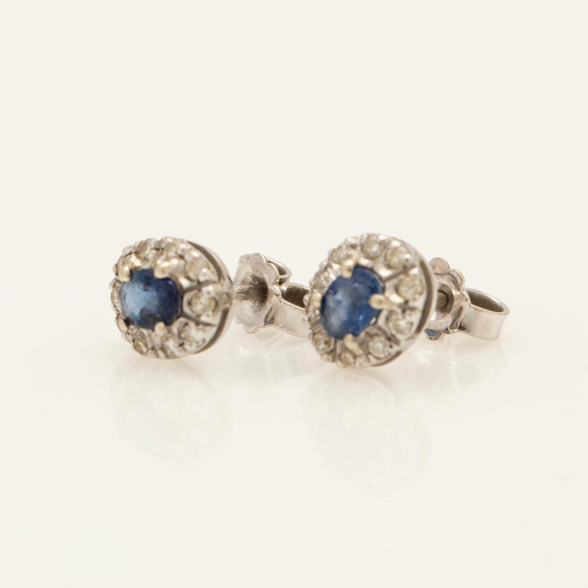 Earrings, a pair, 18k white gold with brilliant-cut diamonds and sapphire.