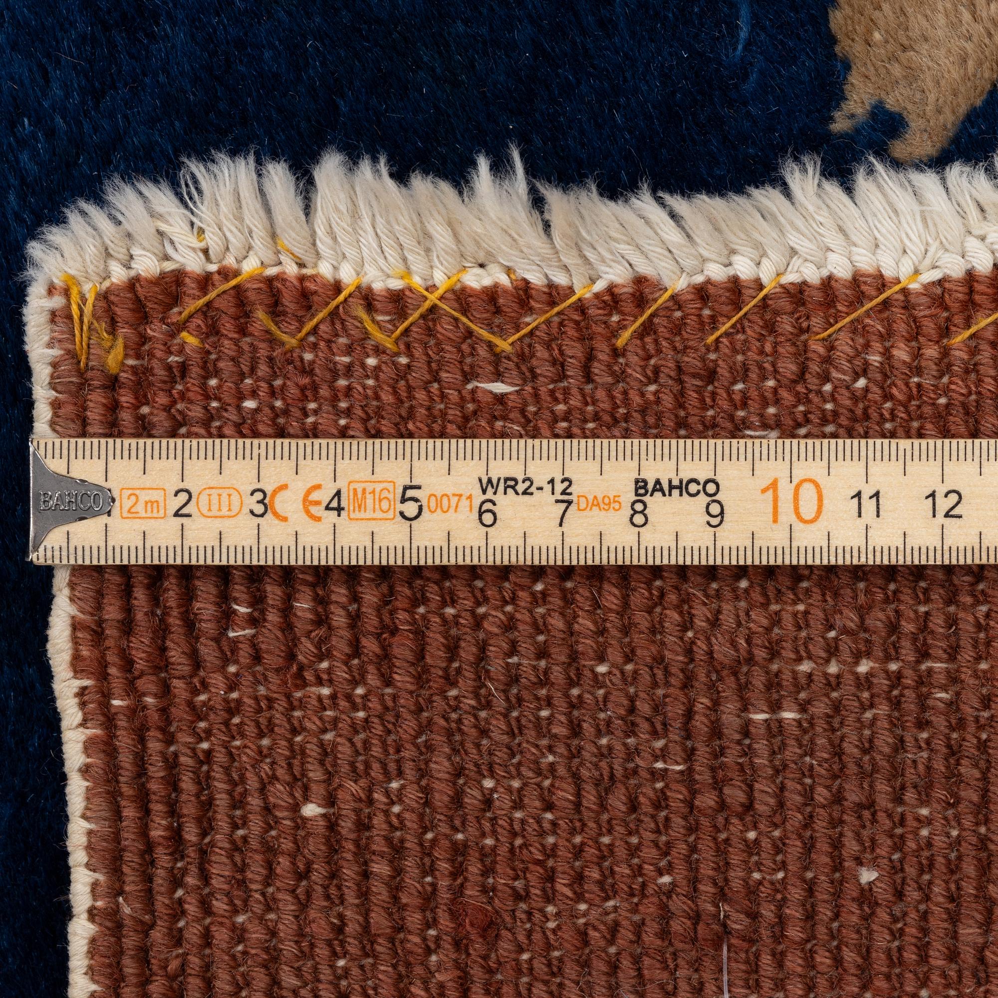 A Chinese art deco carpet, c. 327 x 278 cm.