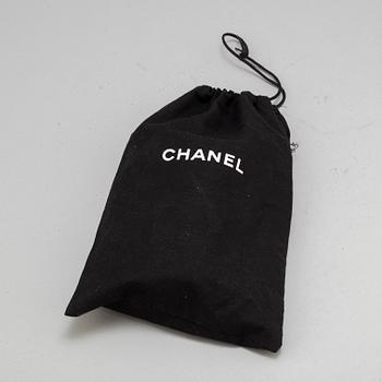 CHANEL, a black leather 'Extra mini flap bag' 2012-13.