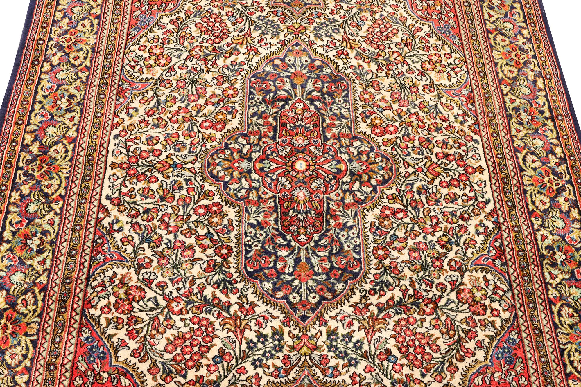 A Ghom rug, c. 202 x 137 cm.