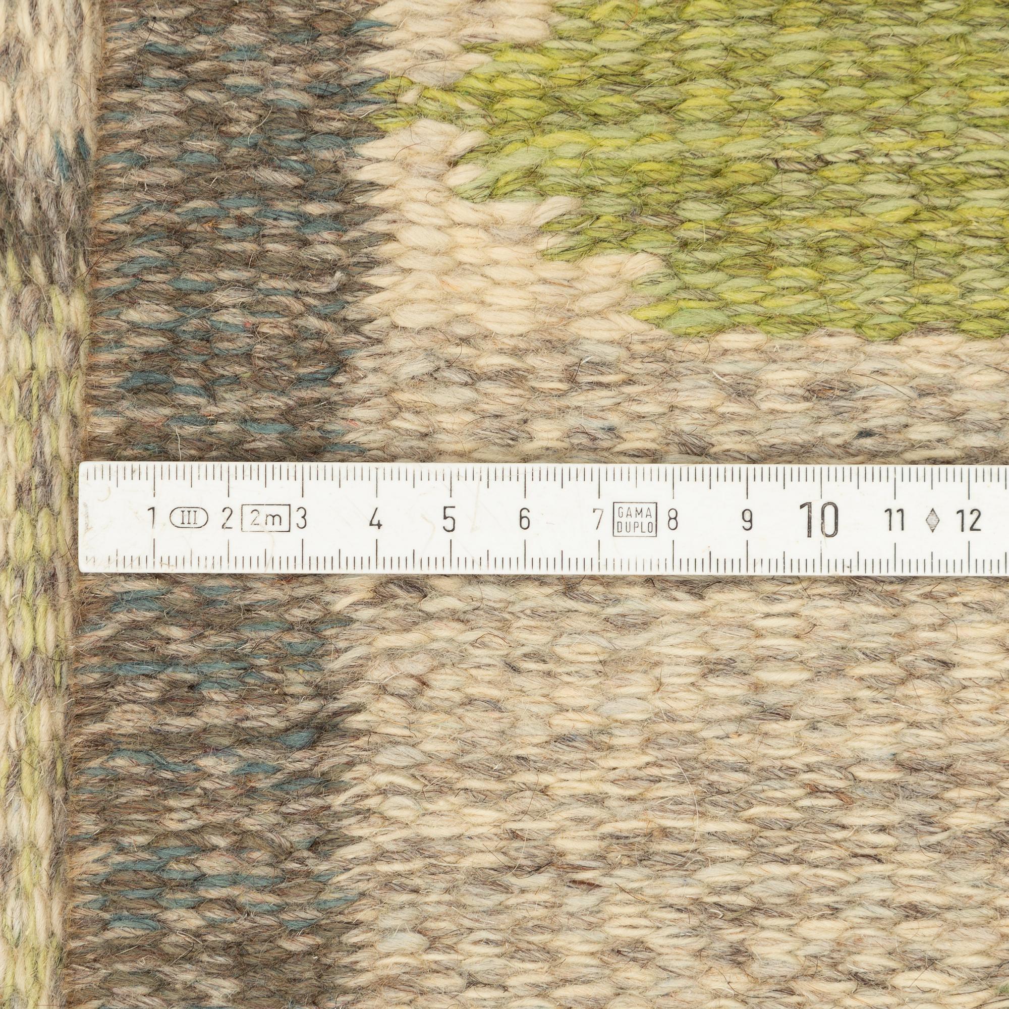 Bittan Bergh-Valberg, a flat weave carpet, signed BA, approx. 303 x 199 cm.