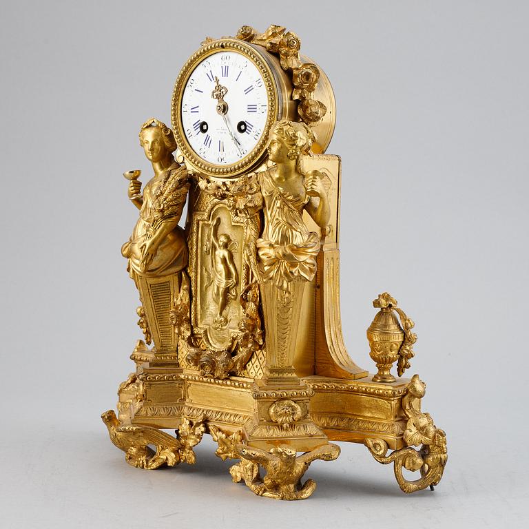 A French gilt bronze mantel clock from Henry Marc á Paris, second half of the 19th century.