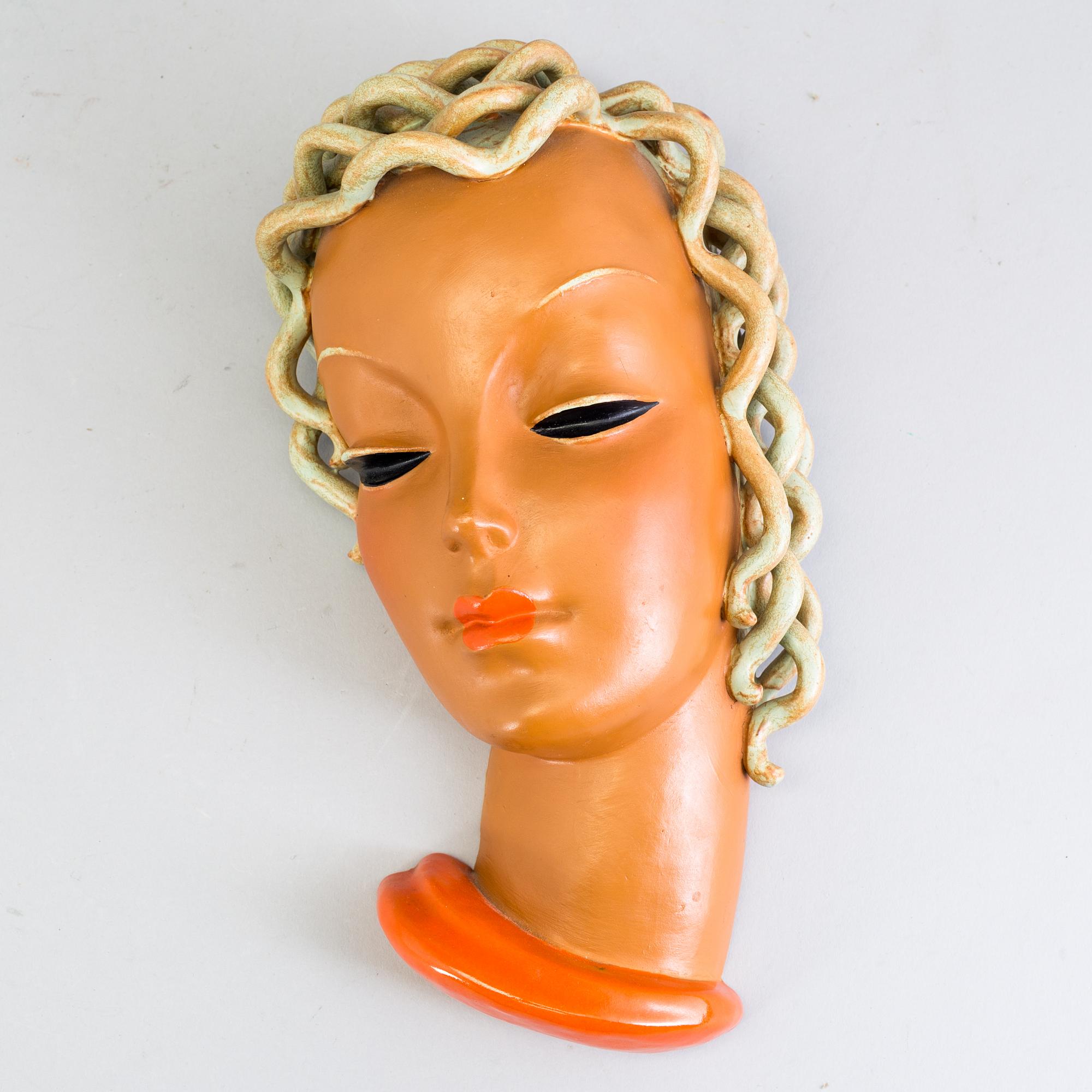 A Goldscheider Vienna terracotta wall mask, stamped model no 7997 ...