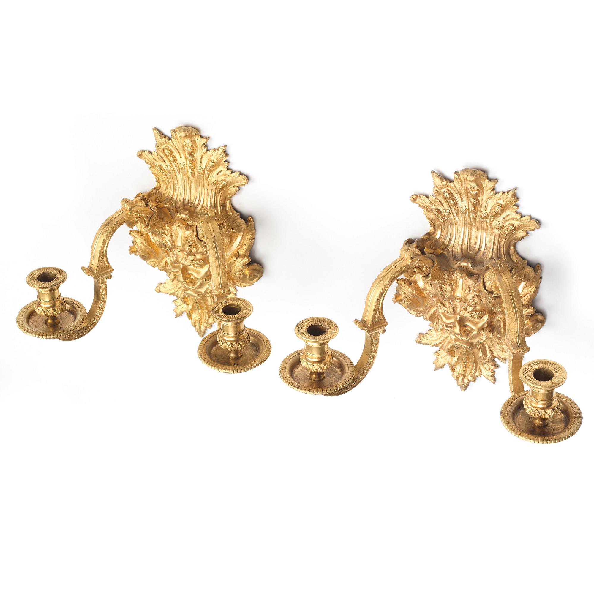 A pair of Baroque-style mid 19th century two-light wall-lights.