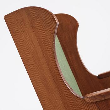 Nordiska Kompaniet, a Swedish Modern stained pine 'Lovö' rocking chair, 1940s.