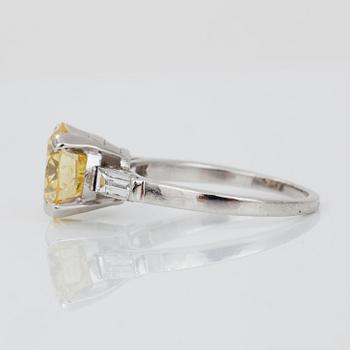 A fancy intense yellow diamond, 2.45 cts, solitaire ring.