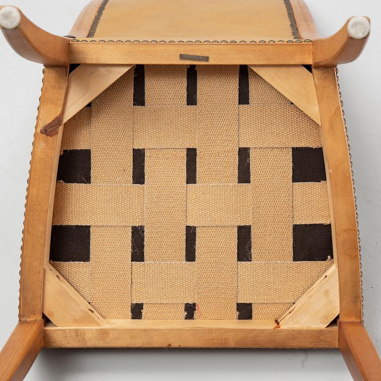 Carl Malmsten, a set of twelve, mahogany and leather chairs. Åfors Möbelfabrik.