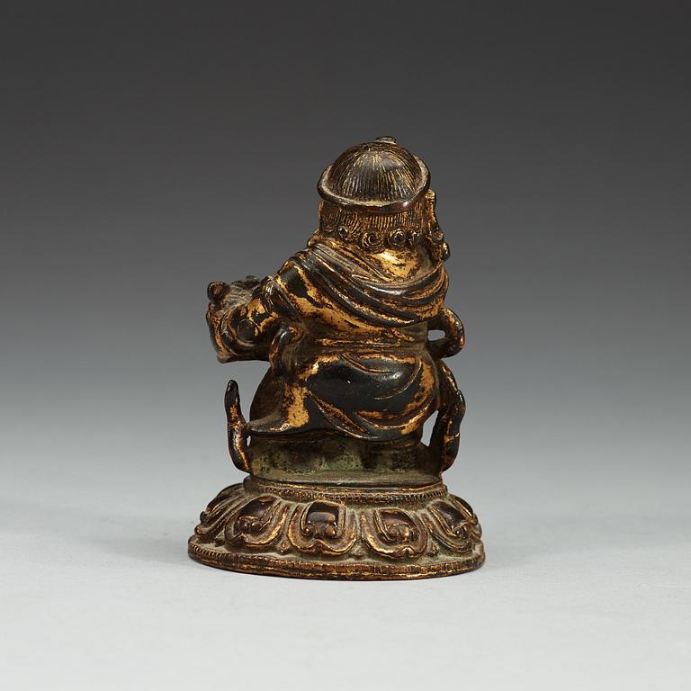 A gilt bronze figure of a guardsman, Qing dynasty (1644-1912).